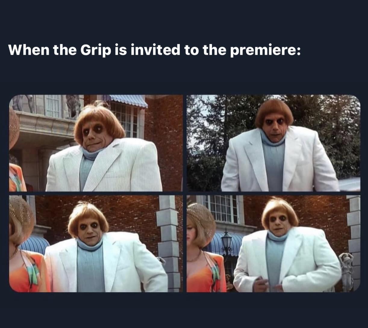 Uncle Fester Addams in a white suit representing the grip crew at the premiere