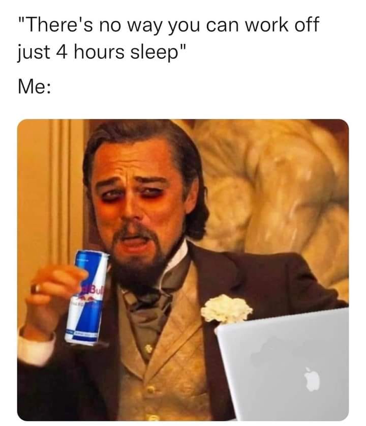 Leonardo DiCaprio from the Django Unchained scene with swollen eyes and a can of Red Bull with a laptop in front of him in the mood; watch me now