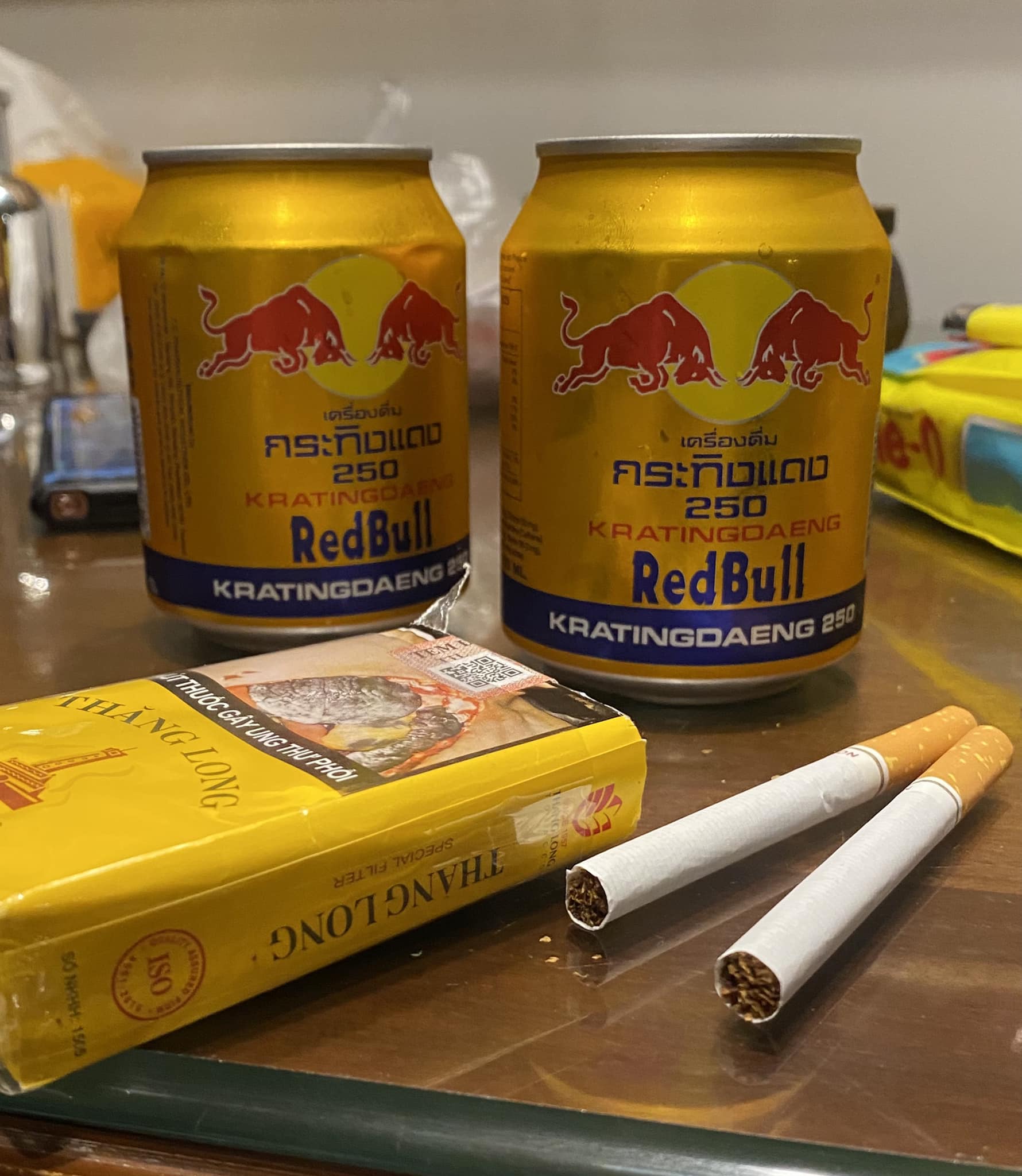 Two cans of Redbull mixed with cigarettes for breakfast